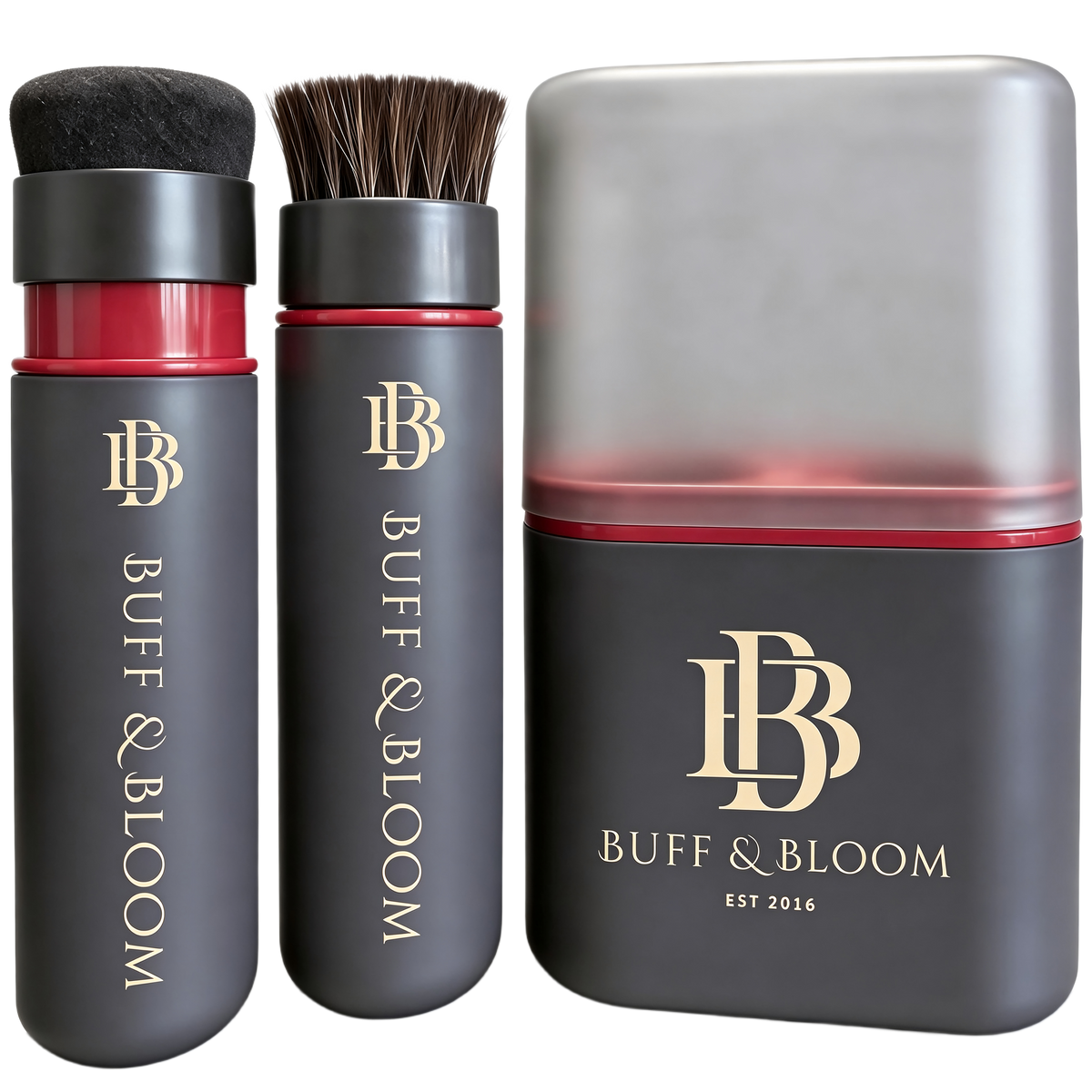 Buff & Bloom haircare set featuring a black cylindrical brush with soft bristles, a matching black cylindrical bottle with red liquid and bristles, and a large rectangular box with a translucent lid and gold logo, all on a white background.