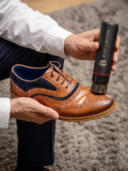 Buff & Bloom motorised shoe polisher being used on a brown leather shoe.